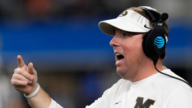 Missouri Tigers head coach Eliah Drinkwitz talks to his team after calling for a timeout against Ohio State Buckeyes in the second quarter during the Goodyear Cotton Bowl Classic at AT&T Stadium